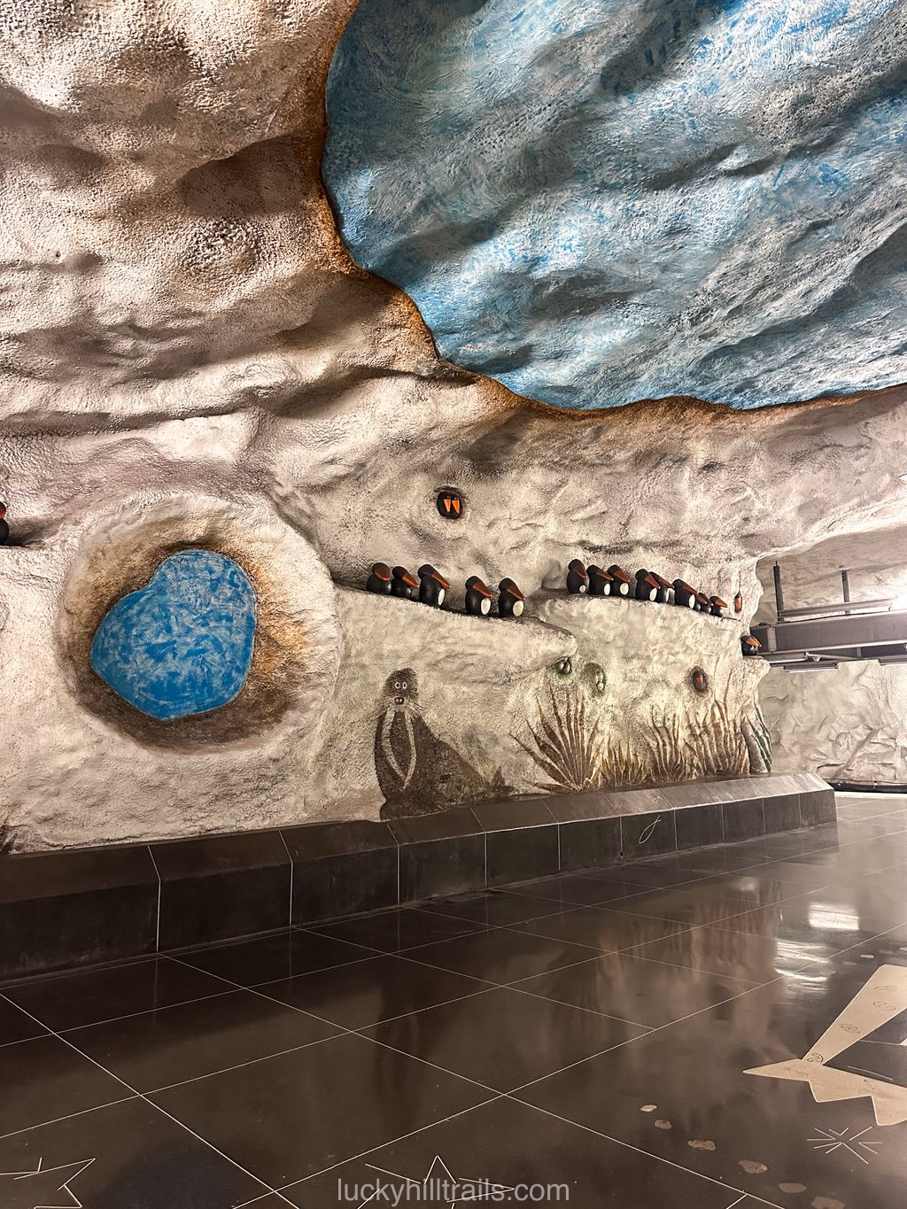 Friendly animal illustrations on the walls of Tensta station in the Stockholm metro